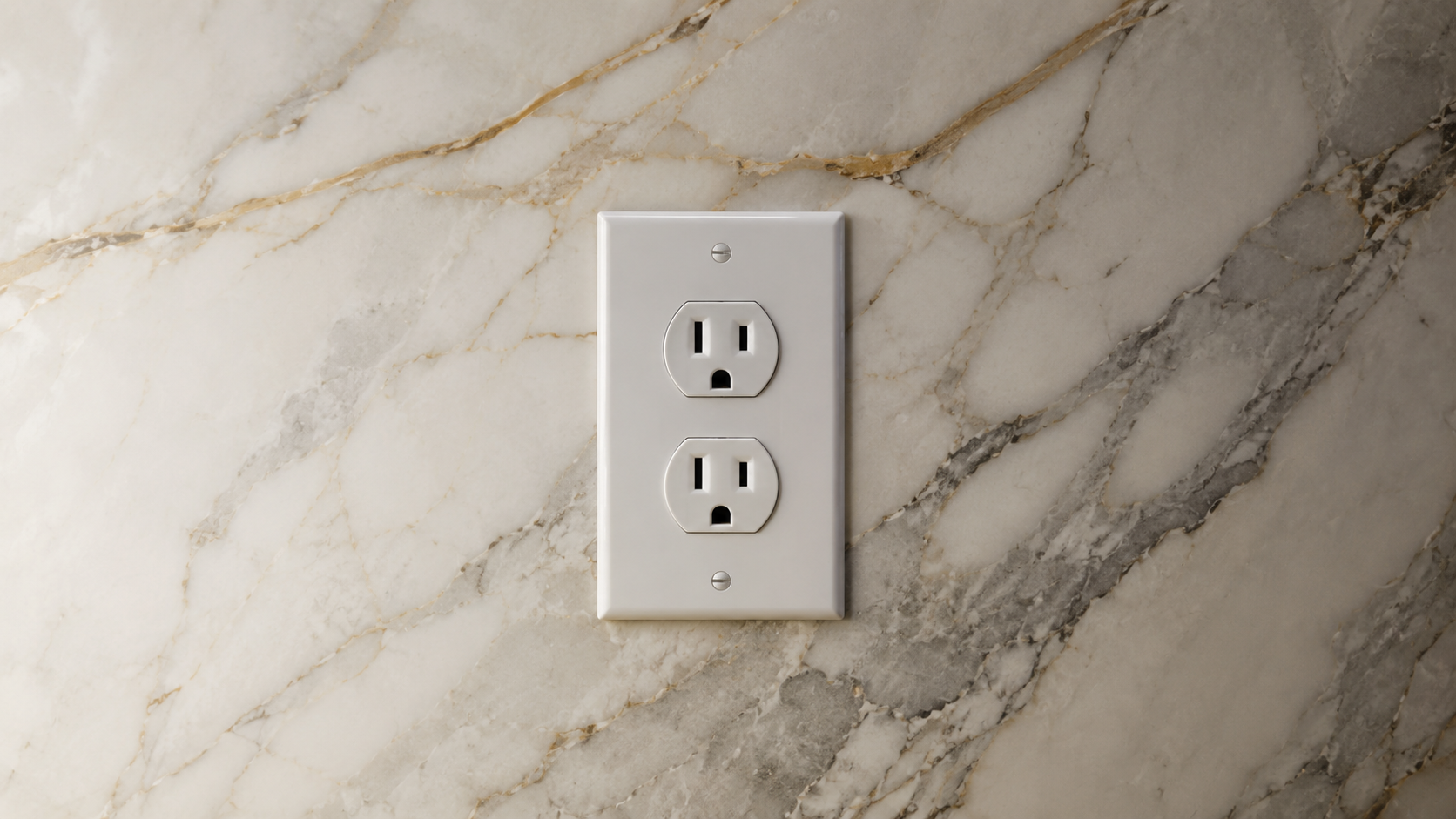 Plastic outlet cover on marble wall